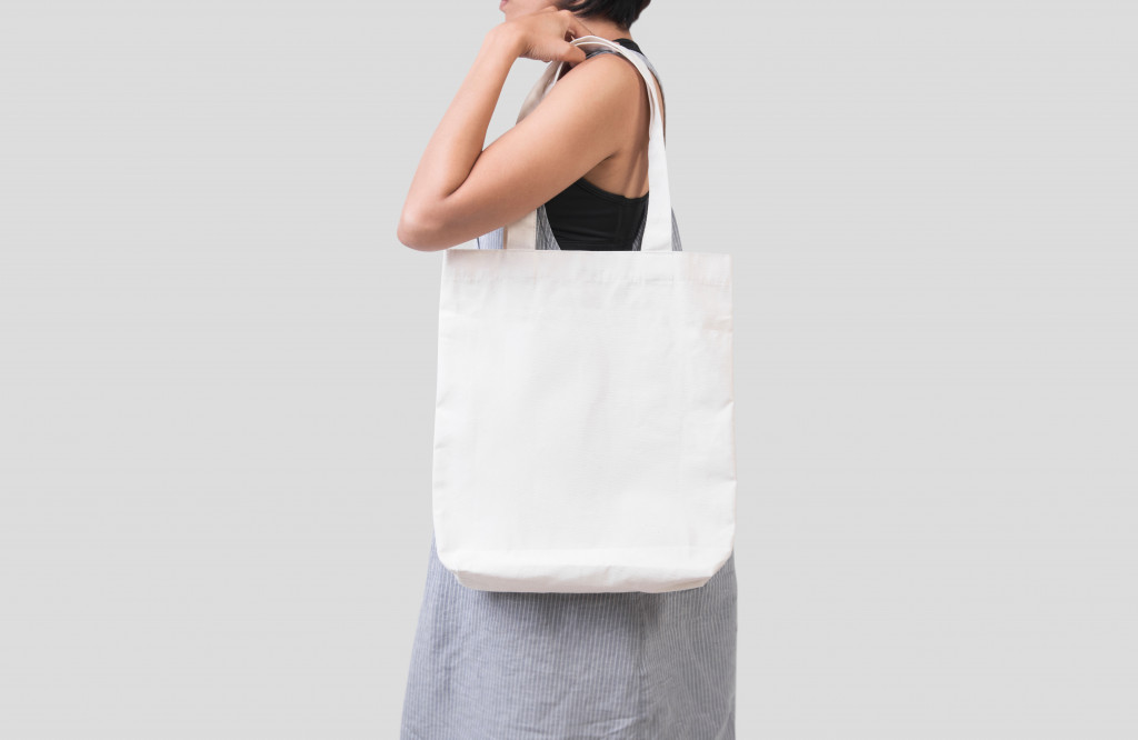 woman carrying a tote bag